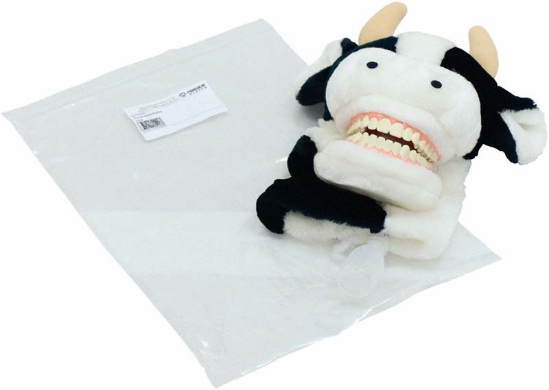 Kuh-förmiges Zahnputzmodell mit beweglichem Gebiss und Verpackung.