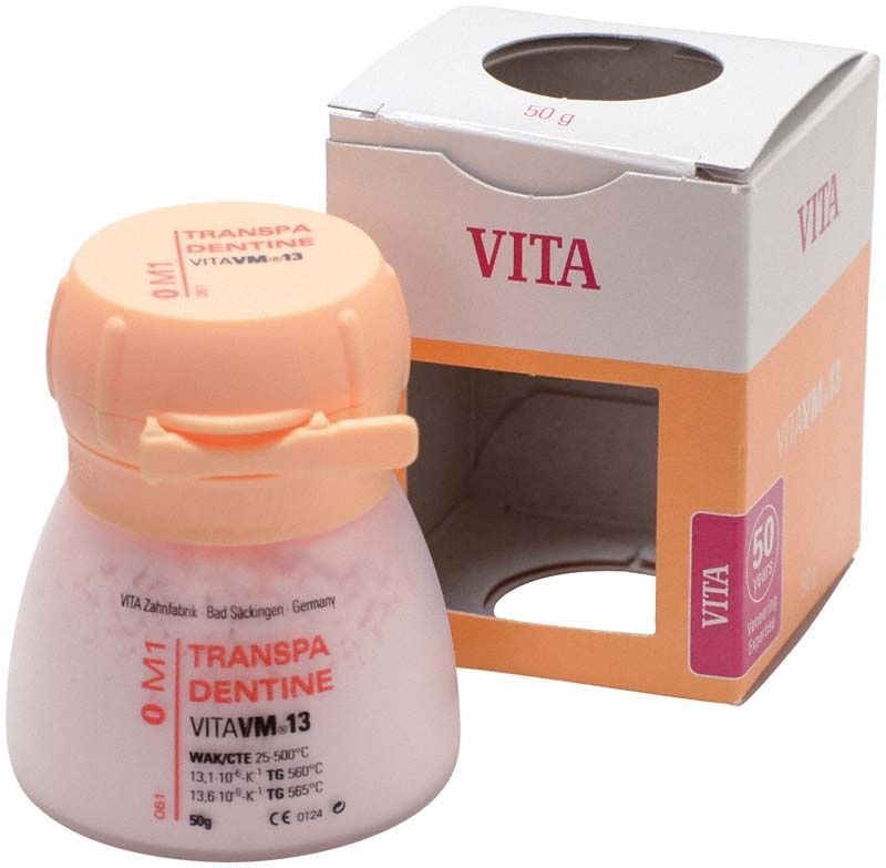 Transpa Dentin VM13 50g, orange Deckel, Verpackung im Hintergrund.