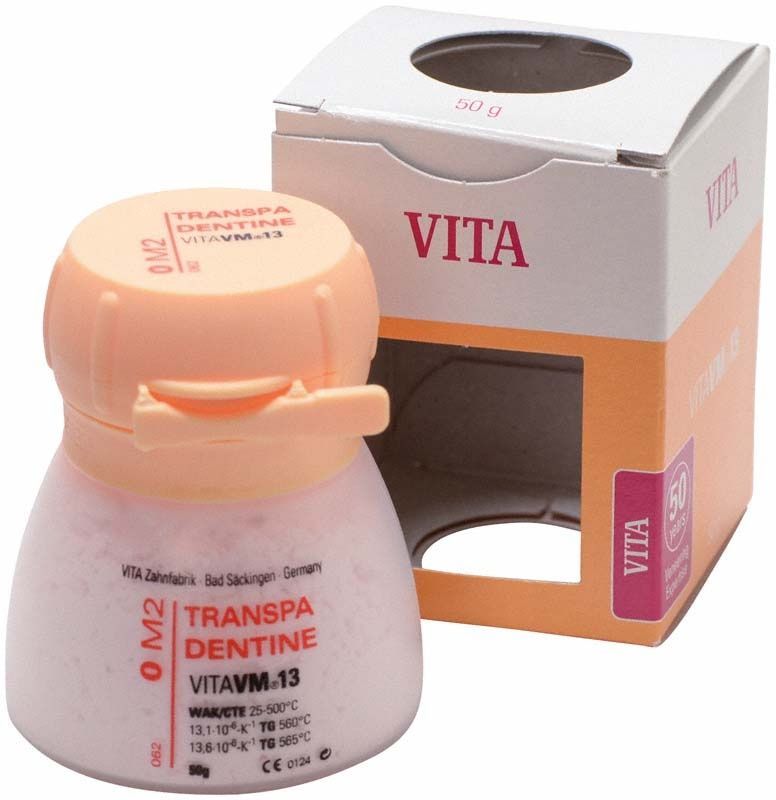 Transparente Dentin-Pulverflasche VM13 0M2 mit Verpackung im Hintergrund.