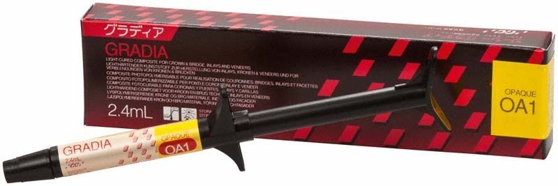 Gradia Opaque OA1 Spritze mit Verpackung auf rotem Hintergrund.