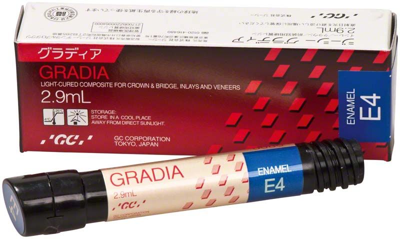 Gradia Enamel E4 in Spritze mit Verpackung im Hintergrund.