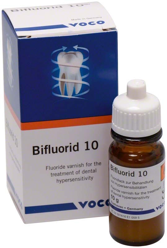 Bifluorid 10 Fluoridlackflasche vor Verpackung mit Zahnabbildung.