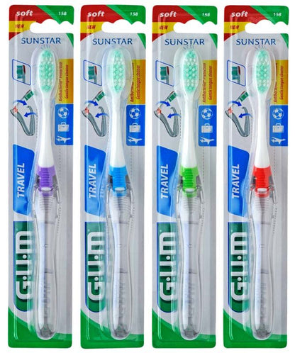 Vier GUM® Reisezahnbürsten in verschiedenen Farben in Originalverpackung.