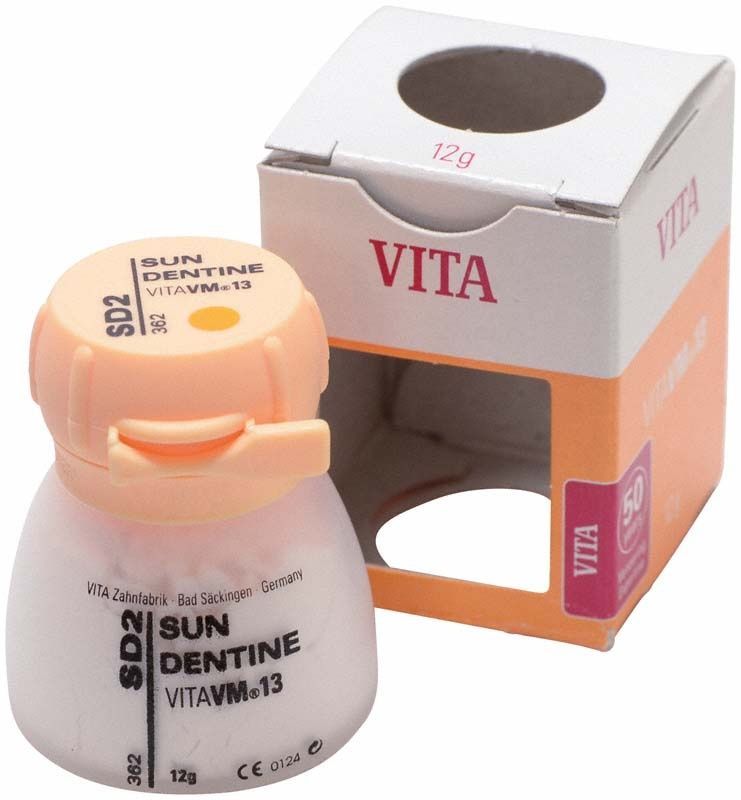Beige Dose VM13 Sun Dentine SD2 neben geöffneter Verpackung.