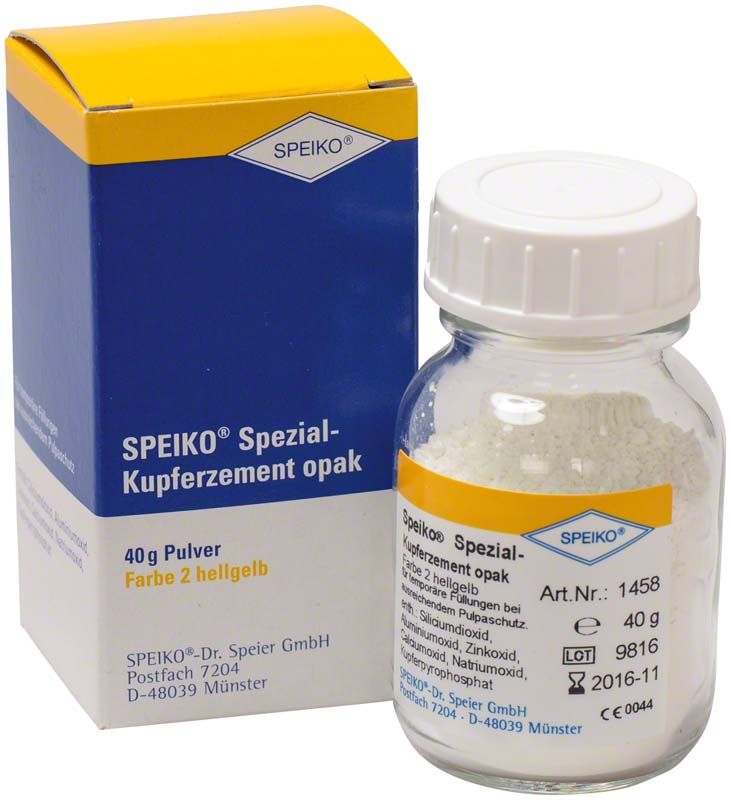 SPEIKO Spezial-Kupferzement opak in Glasflasche neben Originalverpackung.