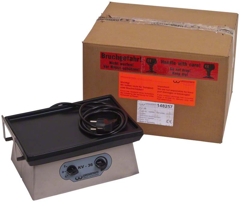 Vibrator KV-36 Edelstahl mit Netzkabel und Verpackung im Hintergrund.