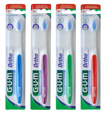 Vier GUM® KFO-Zahnbürsten in verschiedenen Farben in Originalverpackung.