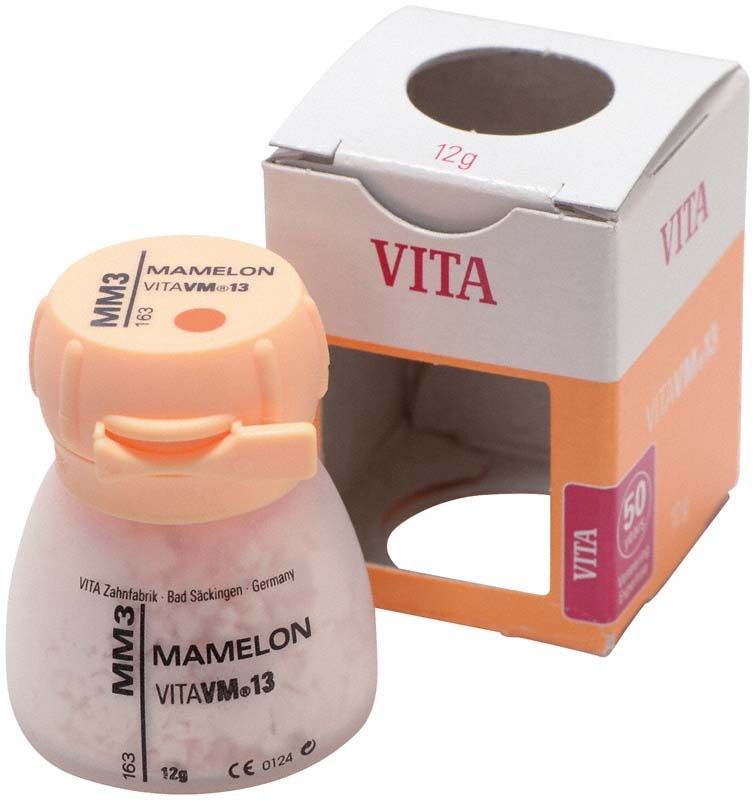 Mamelon VM13 Pulver in einem kleinen Behälter mit Verpackung.