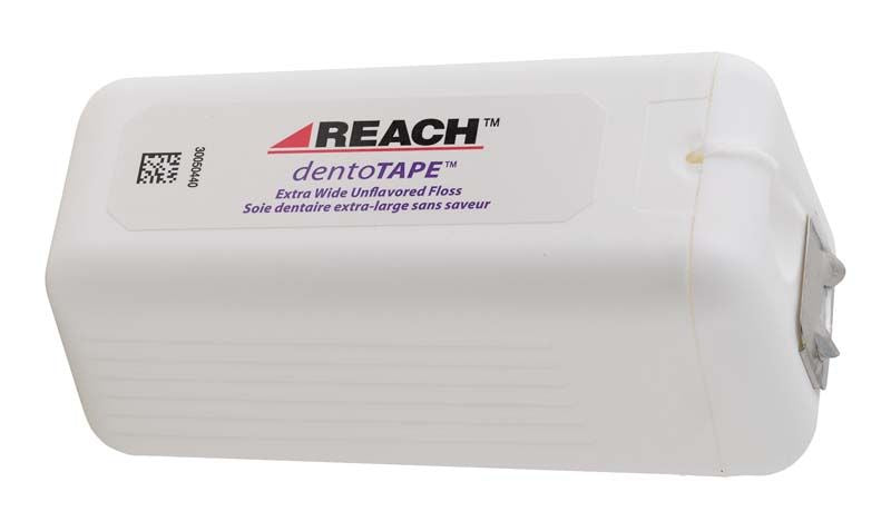 Dentotape Zahnseide Spender in weiß mit Reach-Logo und 100 m Angabe.