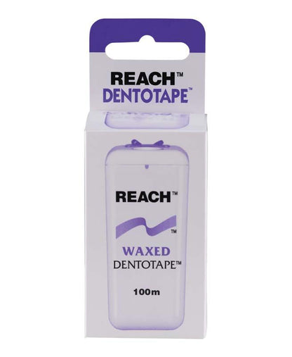 Reach Dentotape gewachste Zahnseide 100 m in lila-weißer Verpackung.