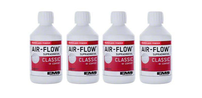 Vier Flaschen AIRFLOW® Pulver CLASSIC Cherry für supragingivale Behandlungen.