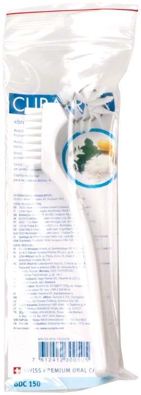 Weiße CURAPROX Prothesenbürste in Kunststoffverpackung.