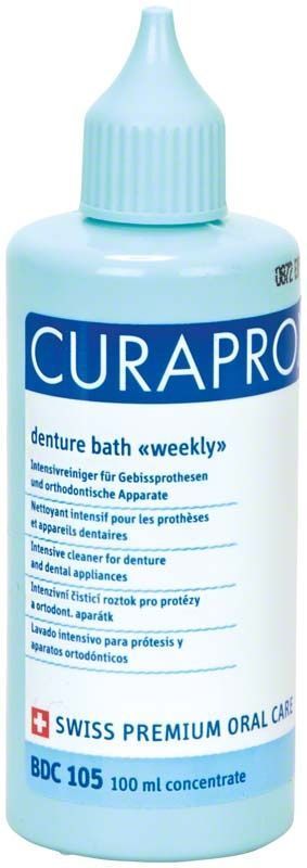 CURAPROX BDC Reinigungskonzentrat für Prothesenpflege in blauer Flasche, 100 ml.