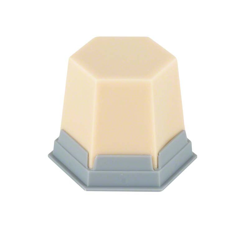 Modellierwachs GEO Classic Natural dentin-opak in sechseckiger Form mit grauer Basis.