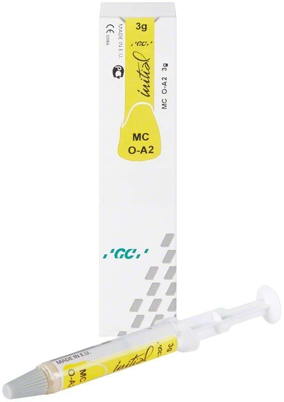 GC Initial MC Paste Opaque OA2 Spritze und Verpackung in Gelb und Weiß.