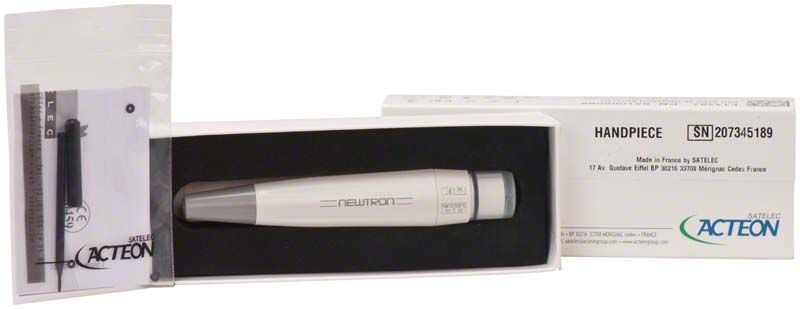 Suprasson Newtron Handstück grau in geöffneter Verpackung.