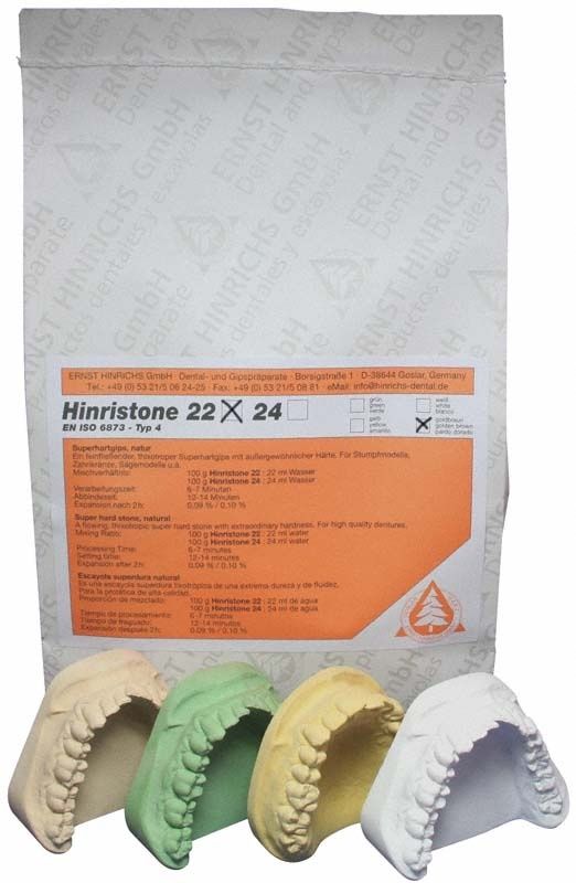 Hinristone® 22 goldbraun 25kg Sack mit Zahngipsmodellen in verschiedenen Farben.