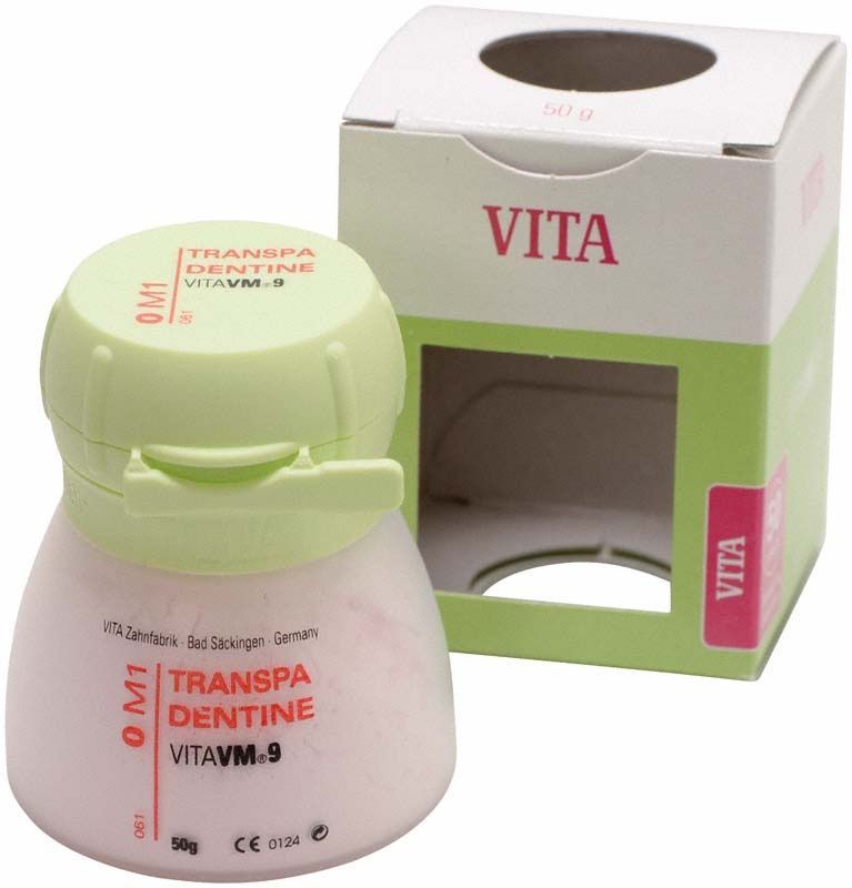 VM9 3D Transpa Dentin 50g 0M1 mit Verpackung im Hintergrund.