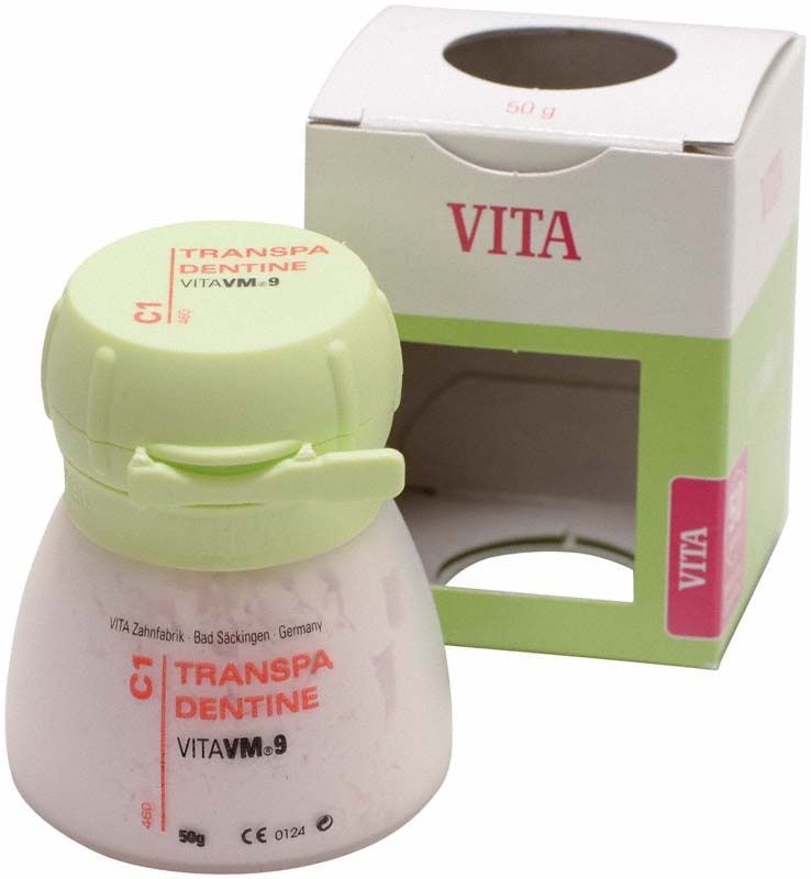Transparente Dentinpulverdose VM9 C1 mit Verpackung im Hintergrund.