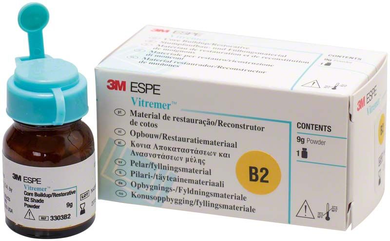 Vitremer Pulver B2 mit Verpackung und Glasflasche mit blauem Deckel.