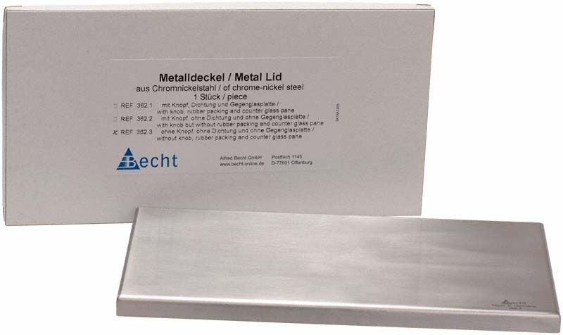 Metallischer Deckel ohne Knopf vor weißer Verpackung.