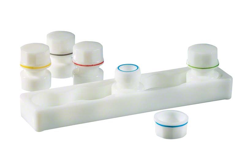 Dappenglasständer aus Opalglas mit fünf farbigen Dappengläsern.