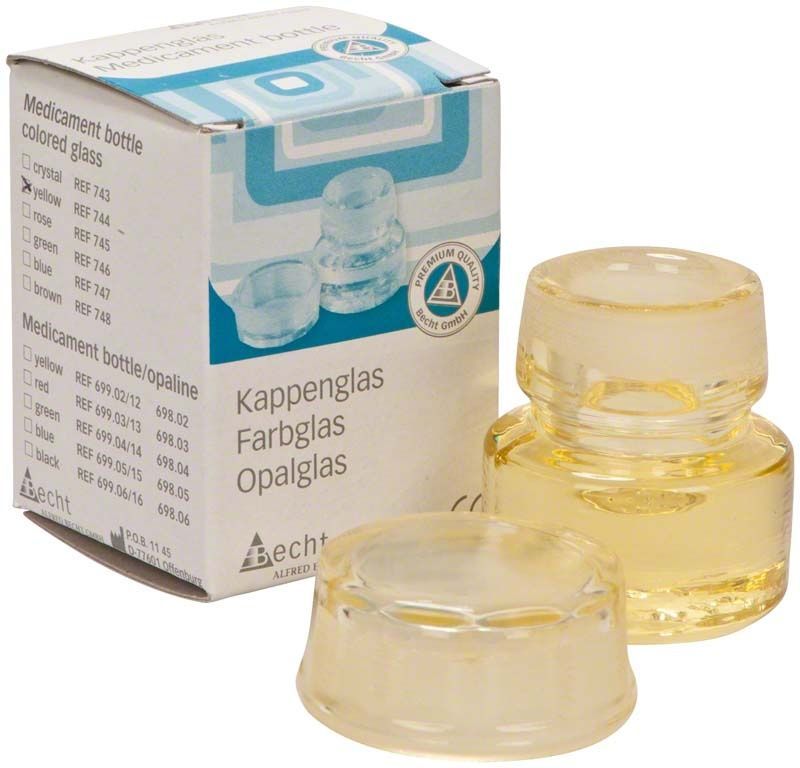 Kappenglas Buntglas gelb mit Verpackung im Hintergrund.