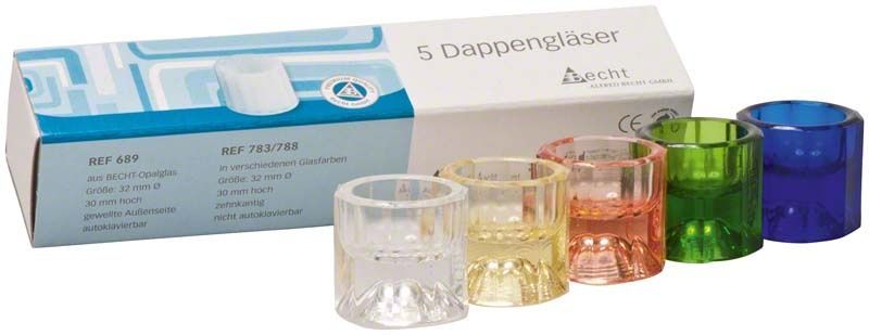 Fünf bunte Dappengläser vor Verpackung mit Produktinformationen.