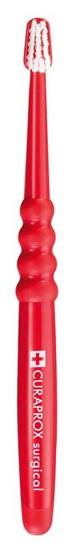 Rote CURAPROX Handzahnbürste surgical mega soft mit ultra-weichen Borsten.