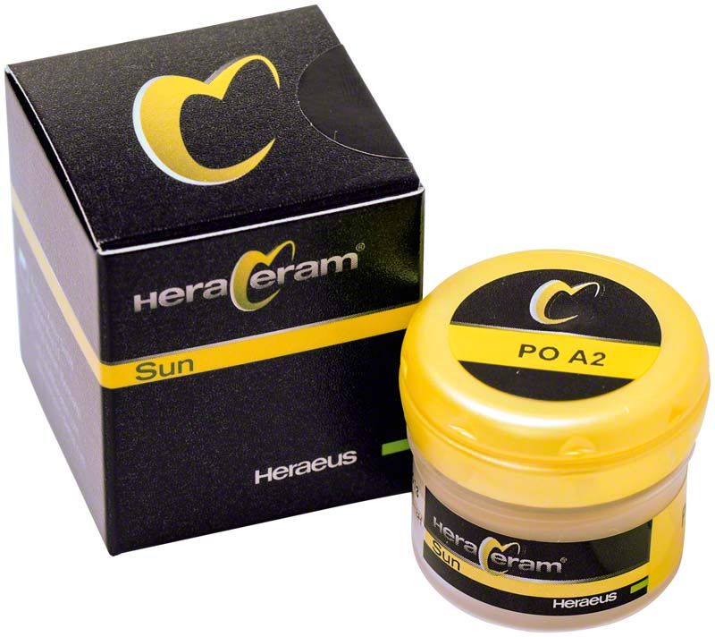 HeraCeram®Sun Pastenopaker PO A2 in gelbem Behälter neben Verpackungsbox.