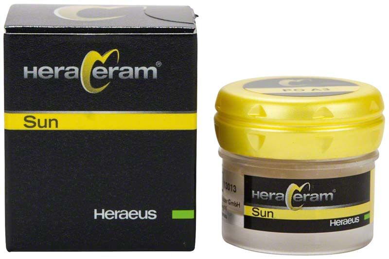 HeraCeram® Sun Pastenopaker PO A3 in gelbem Deckelbehälter neben Verpackung.