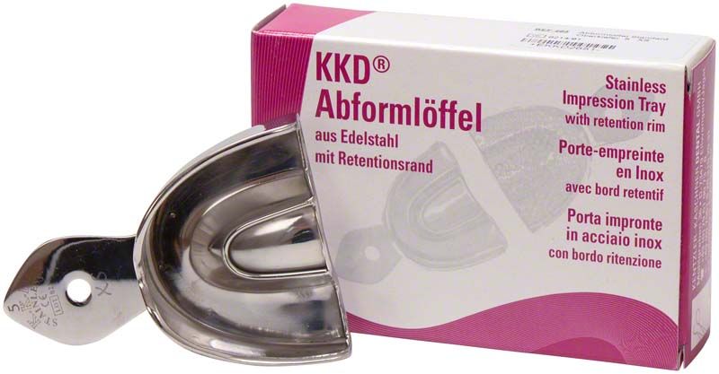 Abformlöffel aus Edelstahl mit Retentionsrand, Verpackung im Hintergrund.