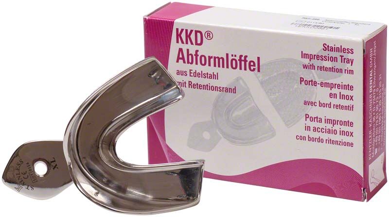 Abformlöffel aus Edelstahl vor Verpackung mit Produktbezeichnung und mehrsprachiger Beschreibung.