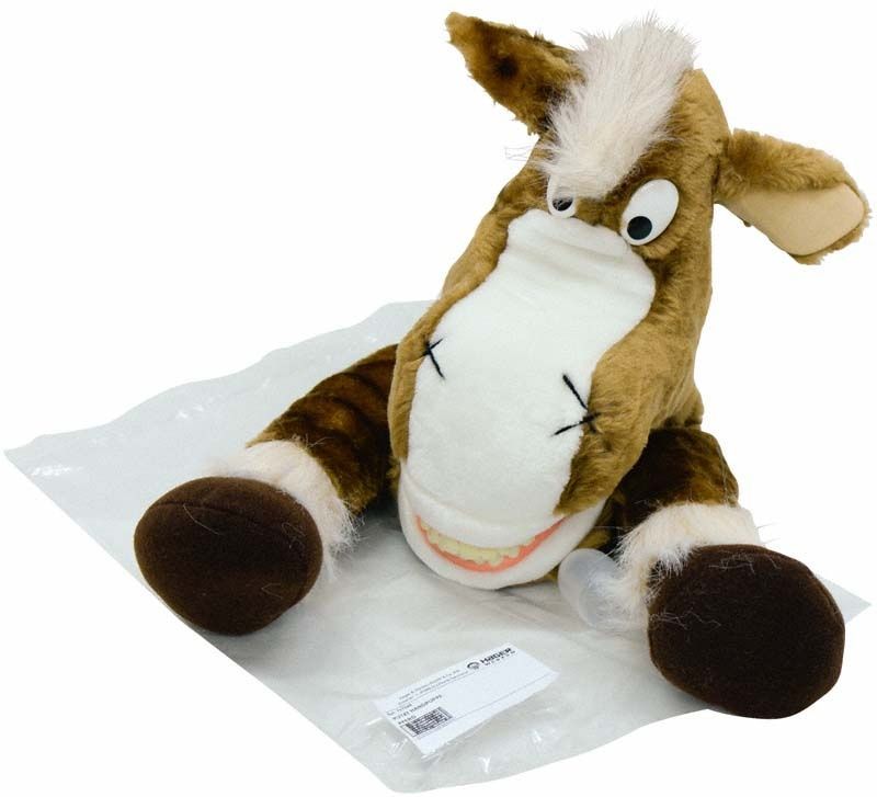 Plüschpferd "Putzi Tier Pferd" mit Zahnbürste und Verpackung.
