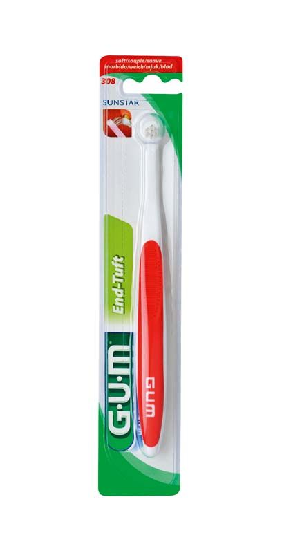 GUM® Büschelbürste in Verpackung mit rotem Griff und kleinem Bürstenkopf.