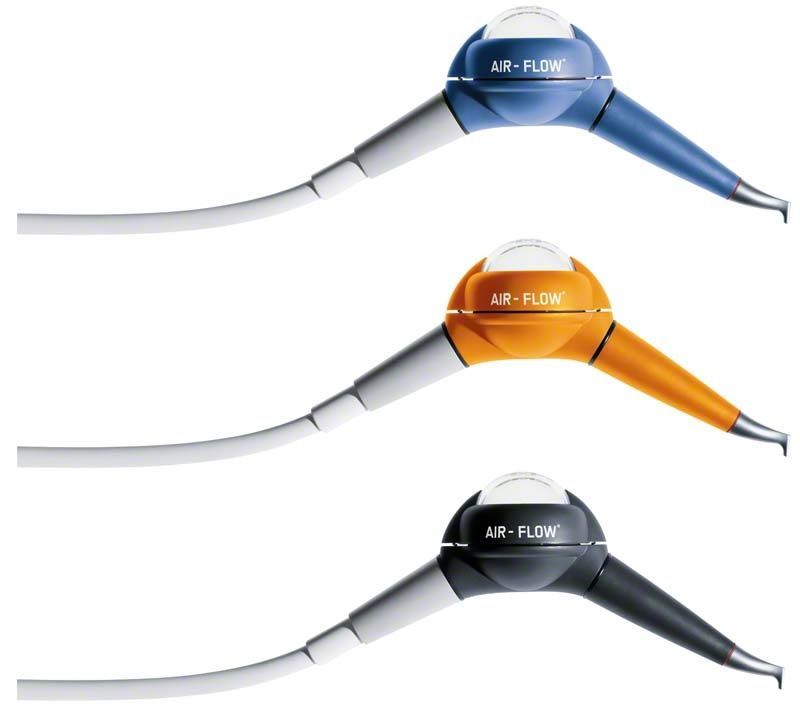 Drei AIRFLOW® Handy 2+ W+H Geräte in Blau, Orange und Anthrazit.