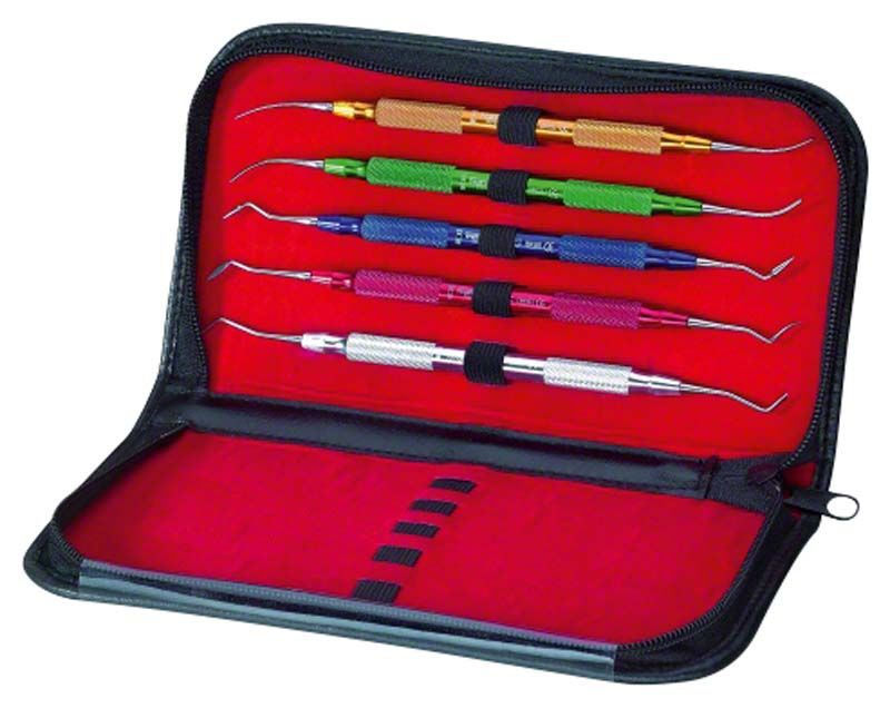 Aufwachsinstrumente-Set mit farbcodierten Griffen in geöffneter Etuiansicht.