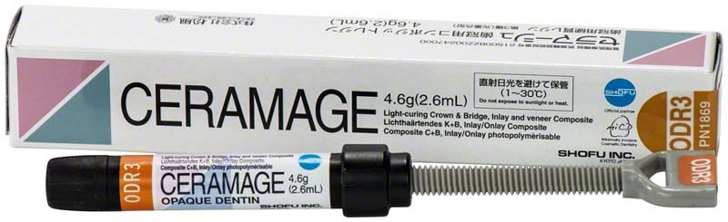 Ceramage Opaque Dentin ODR3 in Spritze mit Originalverpackung im Hintergrund.