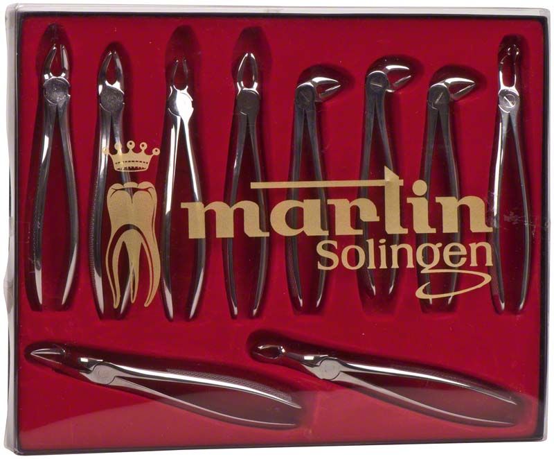 Zahnzangensatz in roter Verpackung mit acht Dentalinstrumenten.