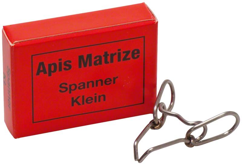 Roter Karton und kleiner Matrizenspanner für Zahnmedizin.