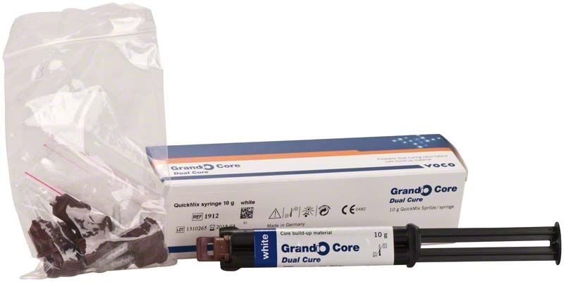 Grandio® Core Dual Cure Quickmix Spritze mit Verpackung und Zubehör.