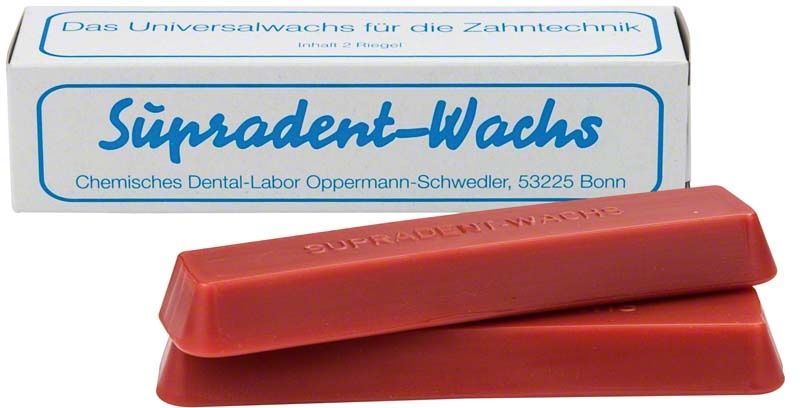Supradent-Klebewachs Doppelriegel vor Verpackung mit blauer Aufschrift.