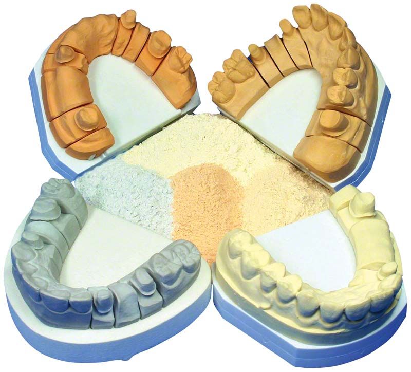 Hinriplast® N Aprikosen-Zahnabdruckmaterial mit Zahnmodellen in verschiedenen Farben.