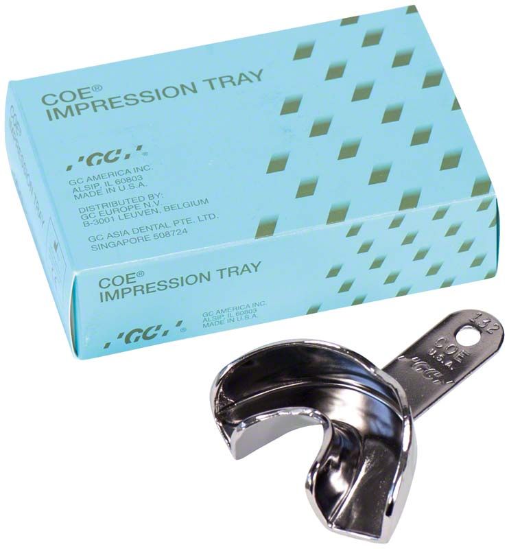 Metall-Löffel unperforiert für Zahnabdruck mit Verpackung im Hintergrund.