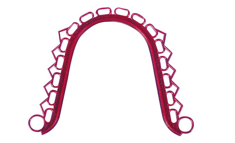 Rote Wachsabschlussleiste mit Retentionen in Bogenform.