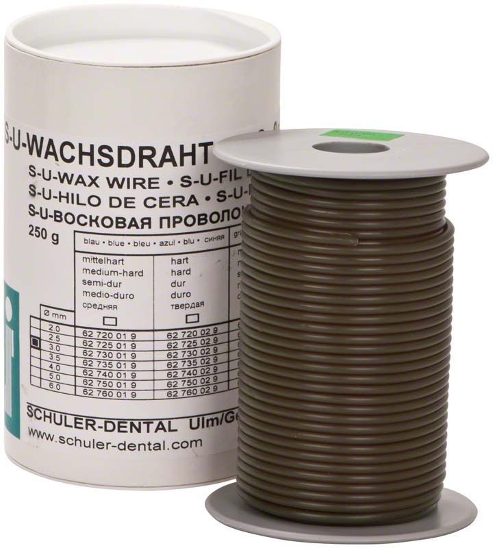 S-U-Wachsdraht grün hart Ø 3,0mm auf Spule neben Verpackung.