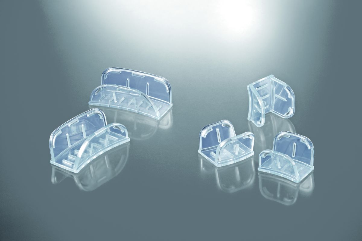 Inlay-Löffel gross für dentale Abformung auf grauem Hintergrund.