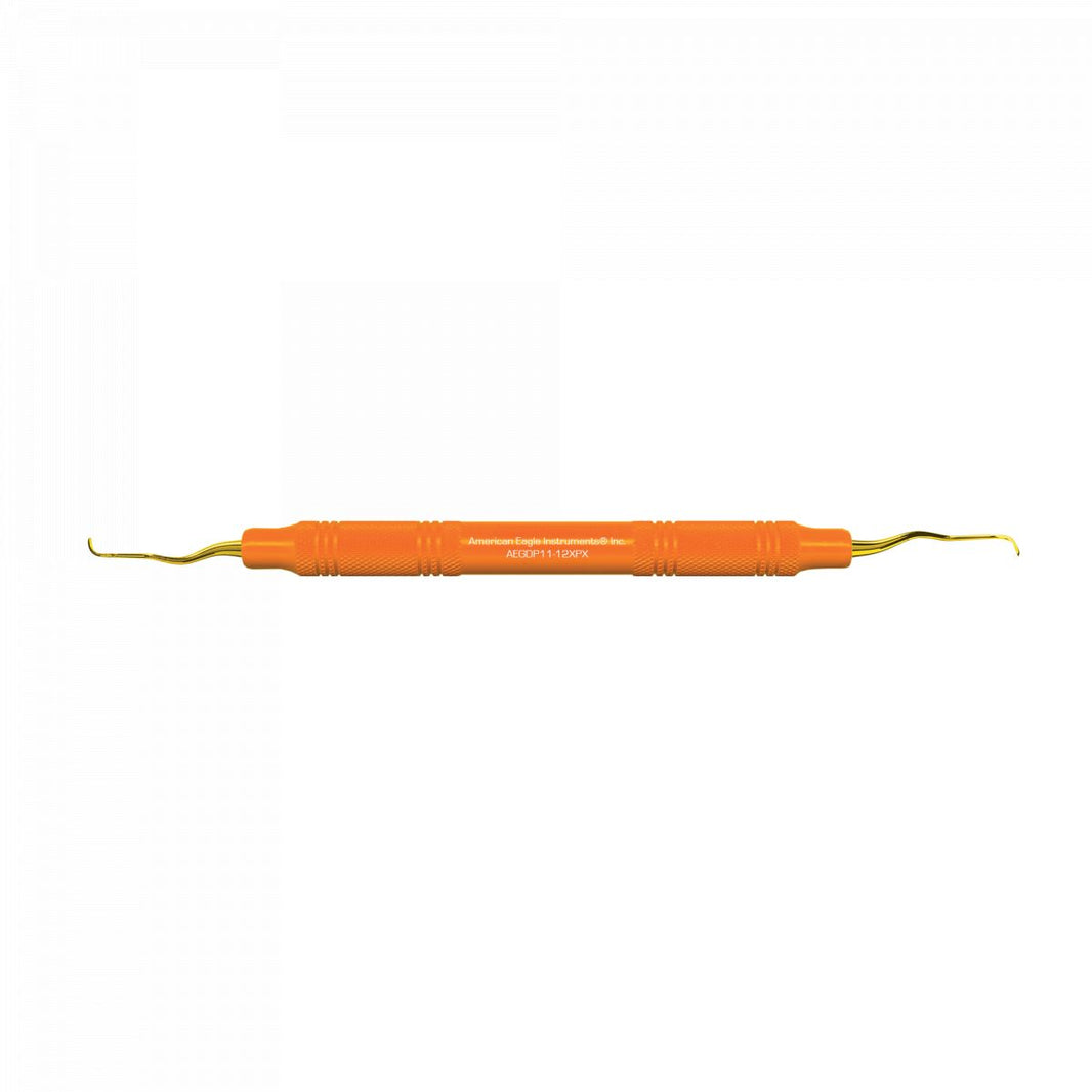 American Eagle XP Gracey +3 Kürette mit goldener Spitze und orangefarbenem Handgriff.