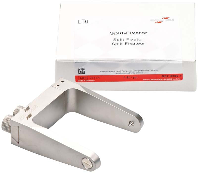 Split-Fixator mit präzisen Zentrierspitzen und Verpackung im Hintergrund.