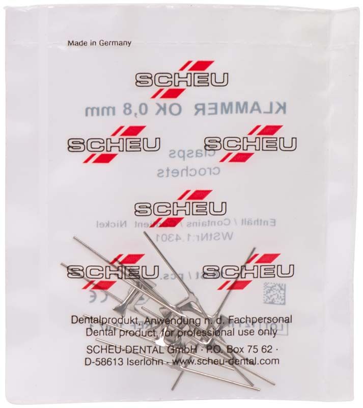 Kieferorthopädische Klammerkreuze aus Edelstahl in transparenter Verpackung.